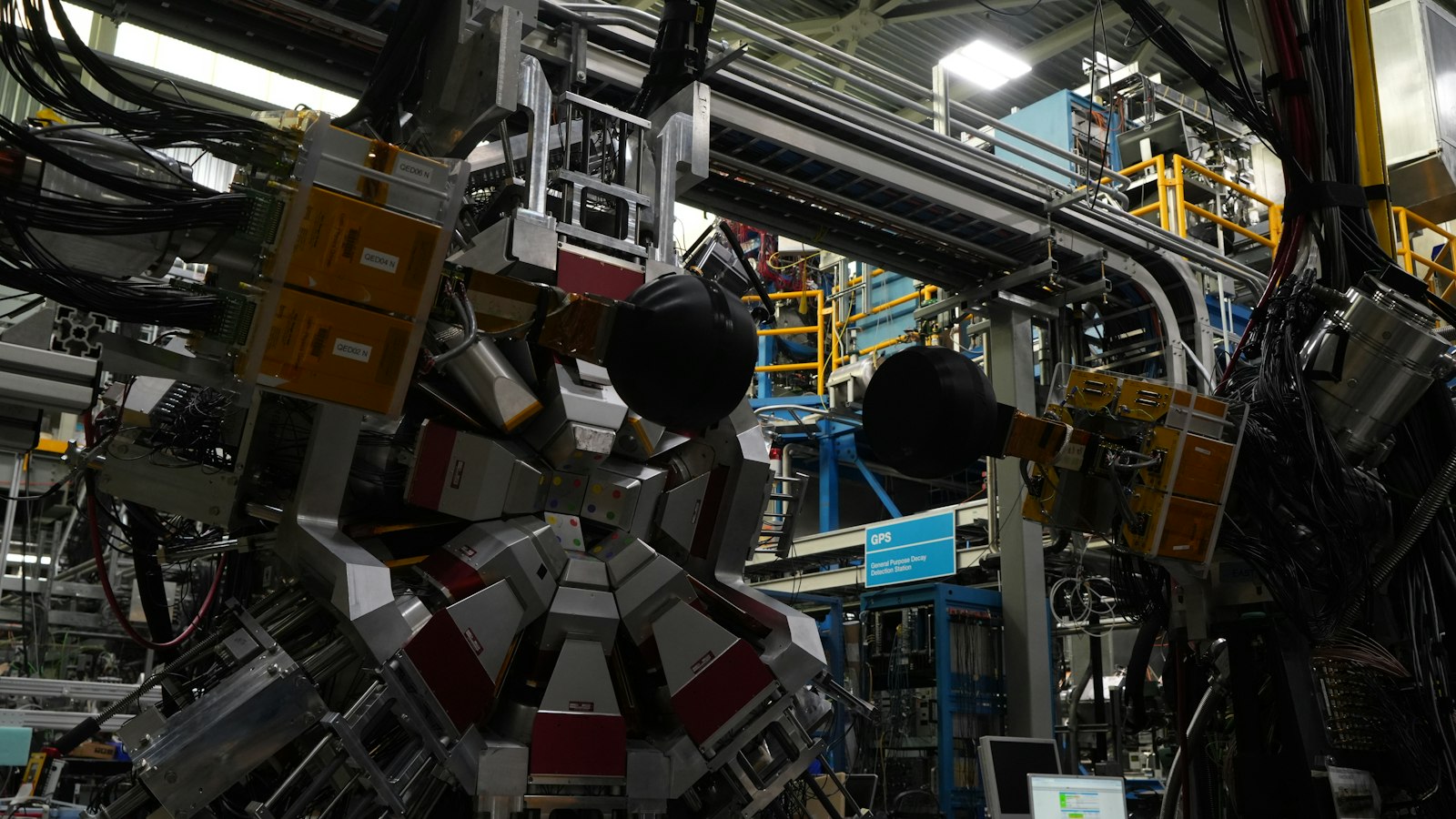 Complex physics research apparatus with wiring and electronic components in a University of British Columbia lab in Vancouver