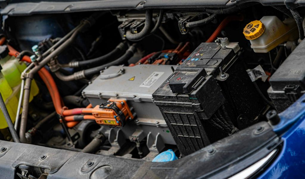 Electric vehicle powertrain with visible wiring, connectors and battery components